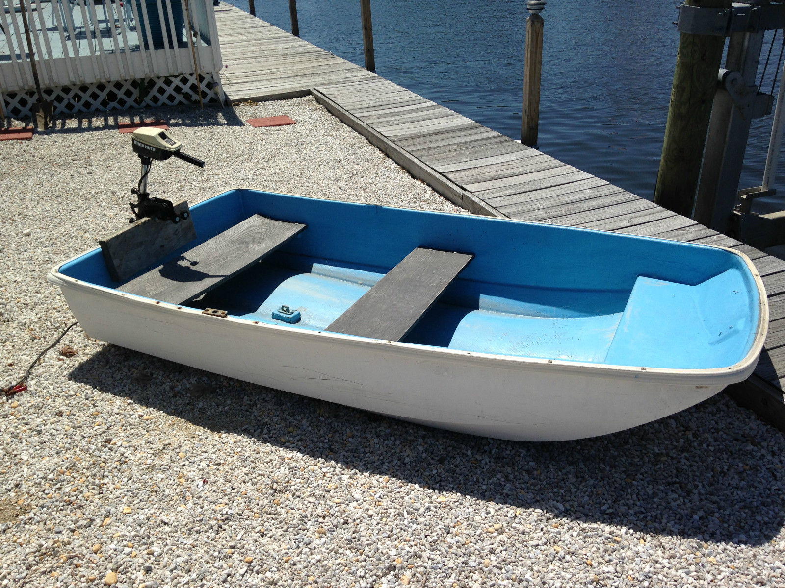 small wooden sailing dinghy - looks like an auk.