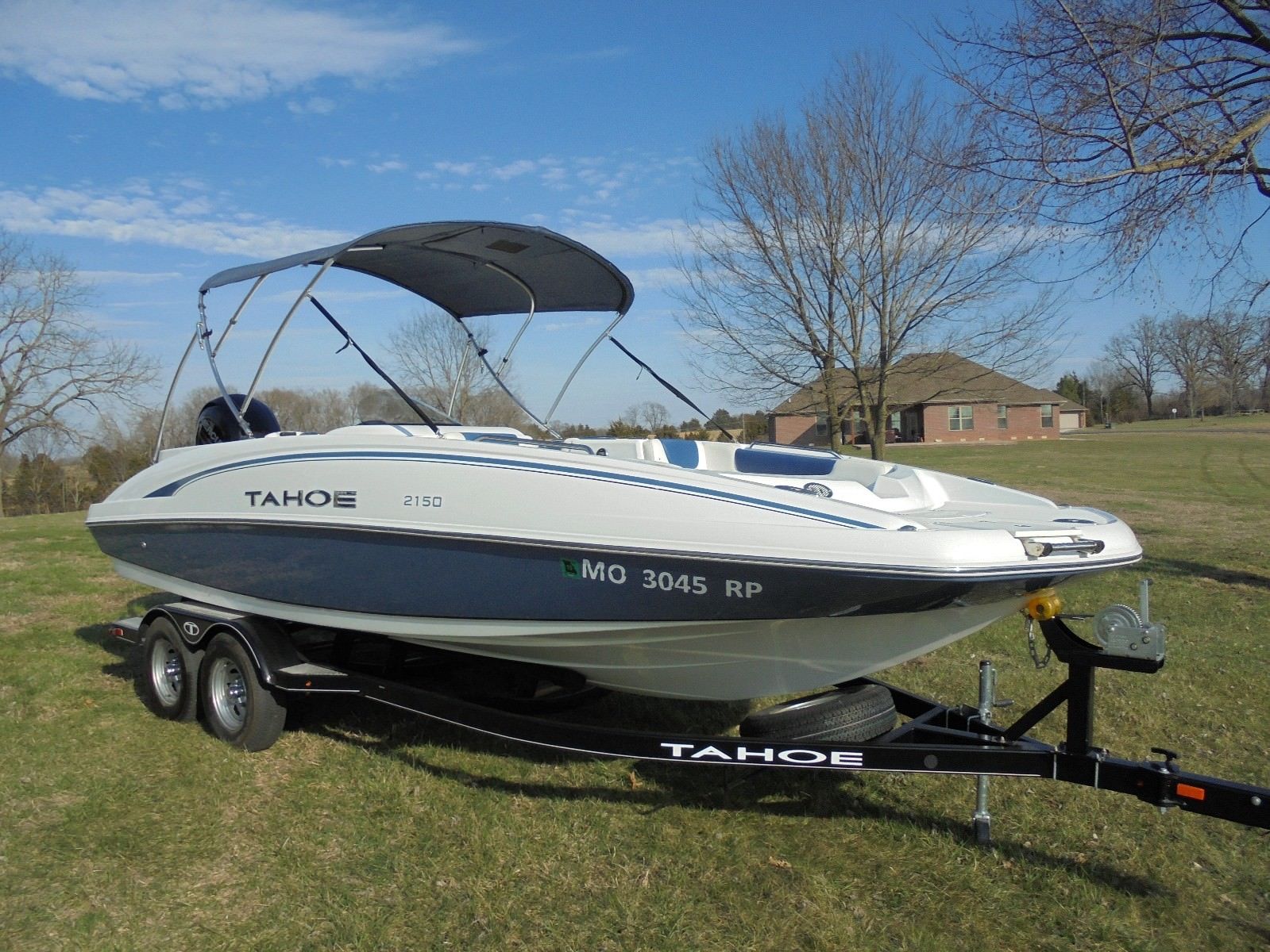 TAHOE 2150 DECK BOAT W/ MERC. 150HP AND A FACTORY TRAILER AND COVER